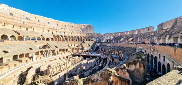 stock image Interior View of the Roman Colosseum-The Colosseum is one of the most iconic and historically significant landmarks in Rome, Italy. It stands as a testament to the engineering prowess and cultural grandeur of the Roman Empire.