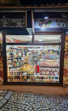 Candy and Nut Store Window in Prizren, Kosovo. Prizren is a historic city in southern Kosovo, known for its rich cultural heritage, picturesque setting, and vibrant atmosphere. clipart