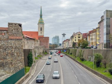 Bratislava Old Town cityscape that shows St. Martin's Cathedral and Most SNP in the background clipart