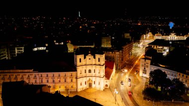 Aerial drone night photo of Bratislava Old Town, Slovakia streets clipart