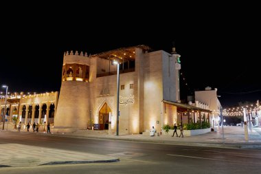 Night photo of a building in the Qaisariya Al-Ahsa Souq Area. It is also known as Souq Al-Qaisariya, is one of Saudi Arabias oldest and most culturally significant marketplaces.