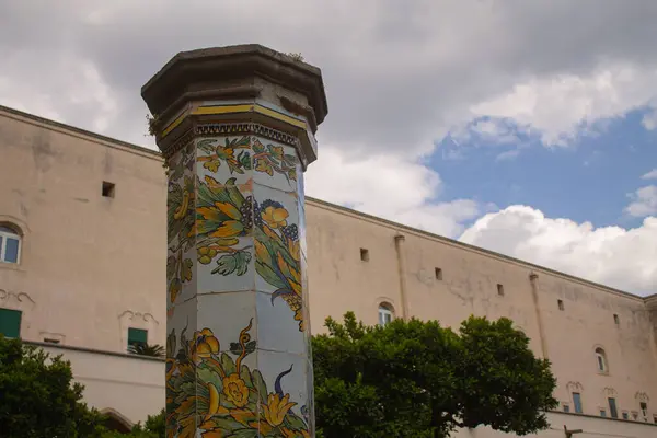 stock image Beautiful tiled pillars with fine decorations on maiolics plated at the cloister garden of Santa Chiara Monastery, Naples, Italy. Vacation in Italy