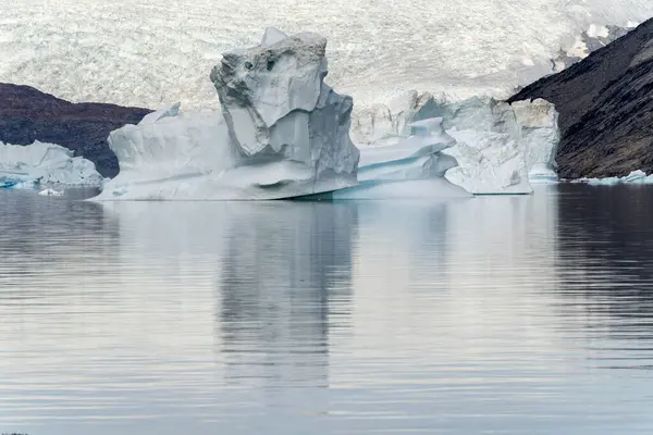 arctic icebergs are melting on arctic ocean in greenland