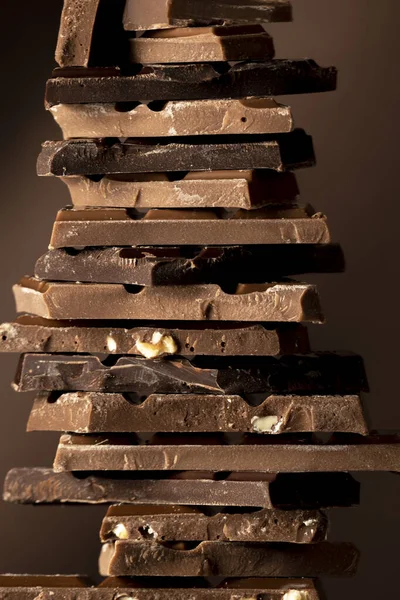 Chocolate tower, variety of different broken chocolate pieces
