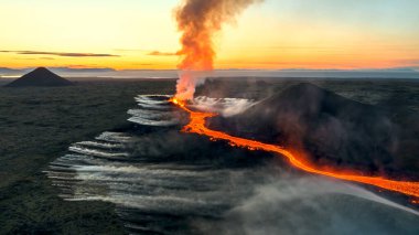 A dramatic and powerful image of a volcanic eruption at sunset. Perfect for science, nature, and extreme-themed projects clipart