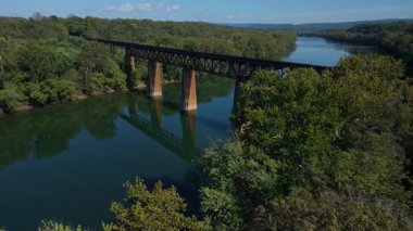 Experience the stunning aerial views of the Potomac River in Shepherdstown, West Virginia, showcasing its vibrant autumn colors, the Potomac River, and historic architecture.