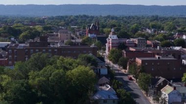Experience the charm of Martinsburg, West Virginia with stunning aerial views showcasing the towns historic buildings and vibrant autumn colors.