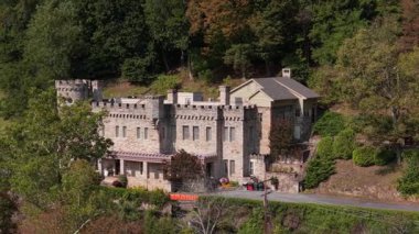 Berkeley Springs, WV, USA - 09 20 2025: Experience breathtaking aerial views of the castle in Berkeley Springs, West Virginia, showcasing summer beauty over the towns historic buildings and lush