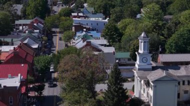 Enjoy stunning aerial views of Shepherdstown, West Virginia, showcasing the vibrant colors of autumn and the charm of this historic small town.