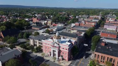 Discover the charm of Martinsburg, West Virginia with stunning aerial views showcasing this picturesque town on a sunny autumn day.