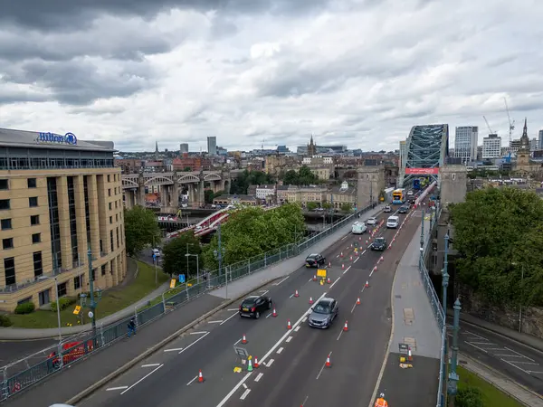 stock image Aerial shot of the Tyne Bridge, showcasing the ongoing roadworks that have reduced traffic to one lane. The image captures the construction activity and its impact on traffic flow, ideal for editorial use in articles about infrastructure maintenance,