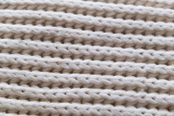 Örgü beyaz kumaş dokusu arkaplanı.