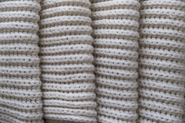 Bir sürü örgü desenli beyaz kumaşın arka planı