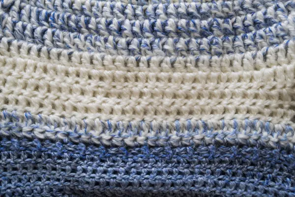 Mavi örgü kazak doku.
