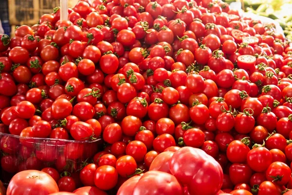 raw tomatoes on market show window. High quality photo