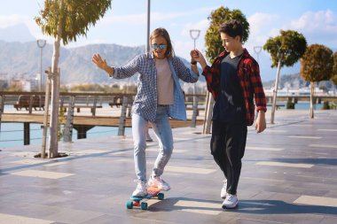 Son teaches mother to stake board. High quality photo