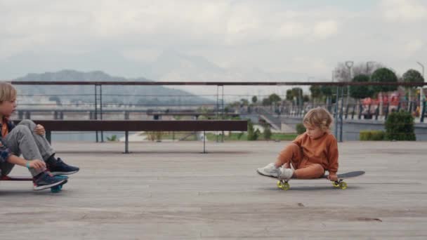 Schoolboy His Little Brother Riding Skateboard Having Fun — Stockvideo