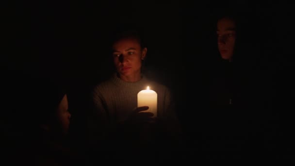 Woman Two Children Waiting Home Candles Blackout Mother Her Sons — Vídeos de Stock