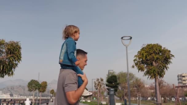 Father Son Walking City Sunset Two Year Old Kid Sitting — Vídeo de Stock