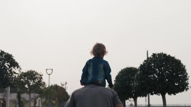 Father Son Walking City Sunset Two Year Old Kid Sitting — Vídeos de Stock