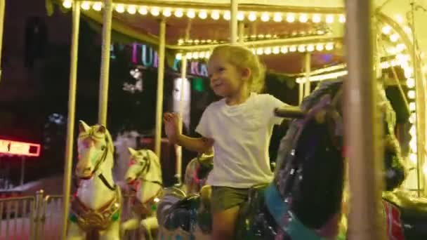 Happy Small Boy Riding Carousel Park Kid Enjoying Summer Night — Stock Video