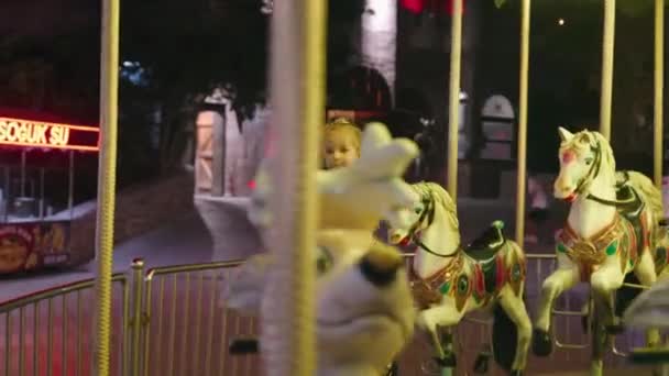 Happy Small Boy Riding Carousel Park Kid Enjoying Summer Night — Stock Video