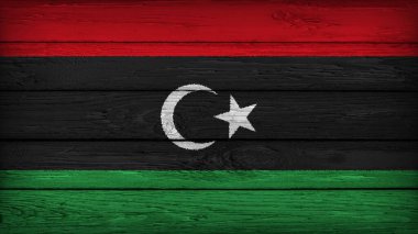 The flag of LIBYA painted on a wooden table with Original Colors clipart