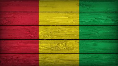 The flag of GUINEA painted on a wooden table with Original Colors clipart