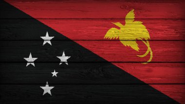 PAPUA YENİ GUINEA bayrağı ahşap bir masaya orjinal renklerle boyanmış.