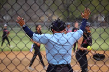 Umpire calling time during softball game clipart