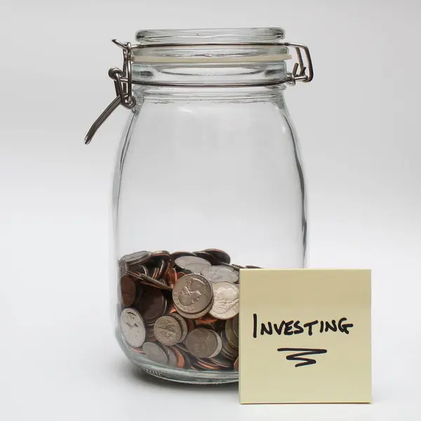 stock image Investment concept with glass jar and coins