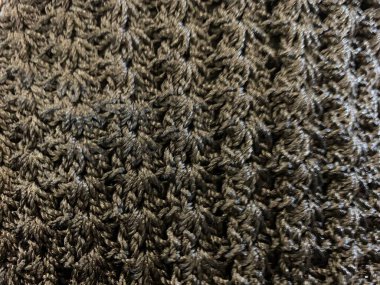 Siyah örgü çanta deseninin ayrıntıları. Örgü örerek yapıldı. El yapımı.