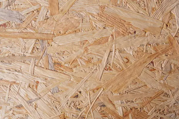 Kaba desenli kahverengi ahşap bir arka plan. OSB paneli. Ahşap yüzey.