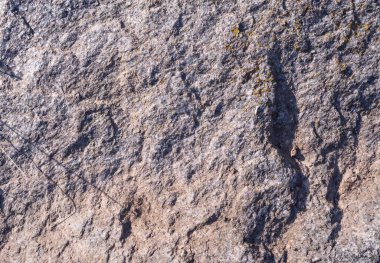 Doğal taştan arka plan. Taş yüzey. Granit taşın dokusu. Doğal yapı malzemesi. Arkaplan için güzel kaya dokusu