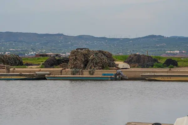 Fishing nets. Fishing ropes are stacked on the shore of the bay. Fishing gear.