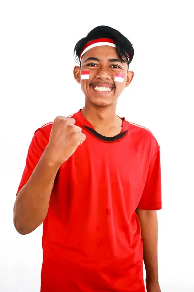 Stock image Indonesian man celebrate independence day with excited expression, Adult Asian man screaming enthusiast with both hands clenched