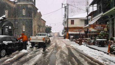 Vytina, Greece - DECEMBER 22, 2017 Heavy snow on the roads clipart