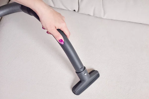 Close Female Hand Vacuums Surface Beige Sofa — Stock Photo, Image