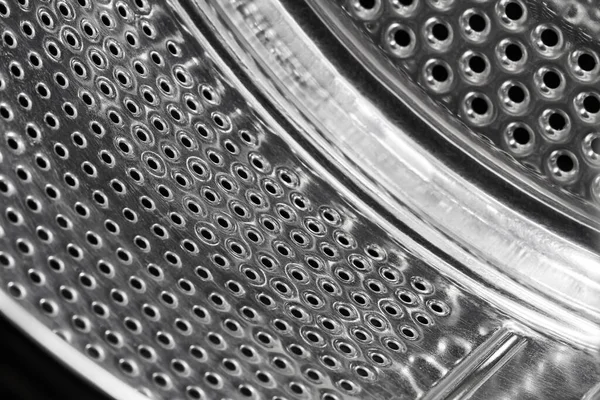 Close-up of inside of a steel washing machine drum