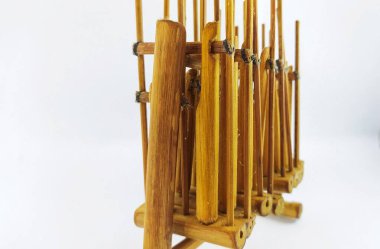 Miniature Angklung, the traditional sundanese musical instrument made from bamboo. Isolated on white background clipart