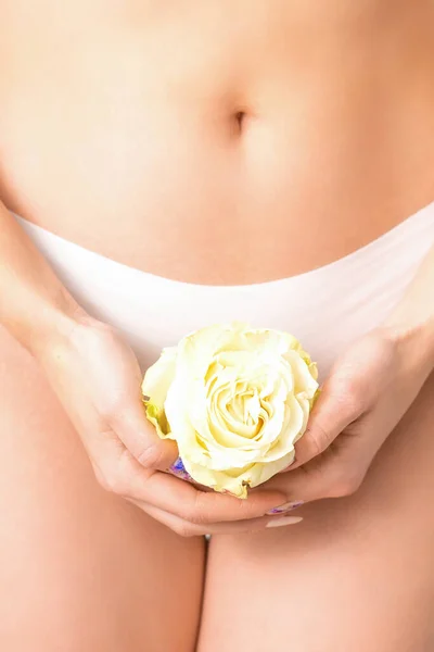 Premium Photo  Hand of a woman wearing white panties holding lollipop on a  stick covering the intimate area, the concept of intimate depilation,  problems of intimate hygiene.