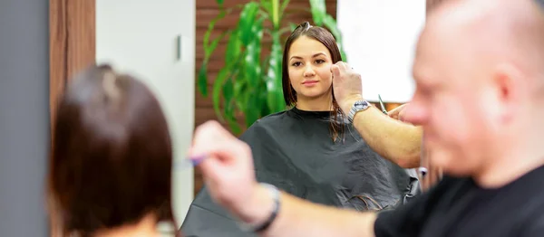 Reflection Mirror Young Caucasian Woman Sitting Receiving Haircut Male Hairdresser — Stock Photo, Image