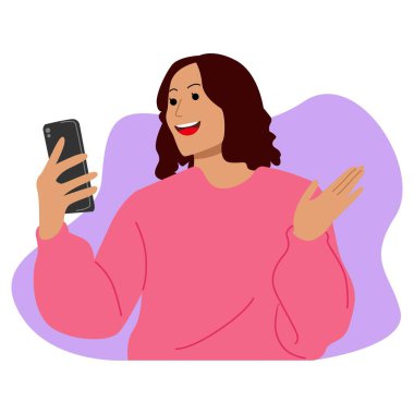 Şok olmuş genç bir kadın akıllı telefonuna bakar.