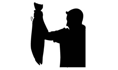 Şefin silueti büyük bir balık tutuyor.