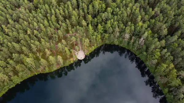 stock image Aerial View of Latvian Lake Surrounded by Forest. Velnezers, Certoka ezers Aglona.