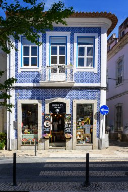 Local corner store blue tiled faade typical architecture Aveiro, Portugal. 