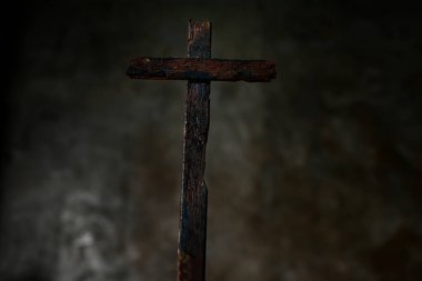 The scary makeshift wooden crosses in the dark and muted background clipart