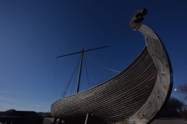 Scandinavian warships or Longship docked on the icy sea. Longship was originally invented and used by the Norsemen, commonly known as the Vikings.  clipart