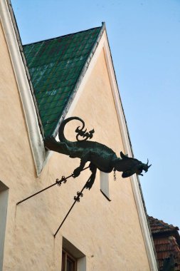 House decoration drainpipe in the form of a dragon. Decoration. clipart