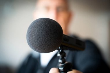 Germany. Man with microphone and windscreen clipart